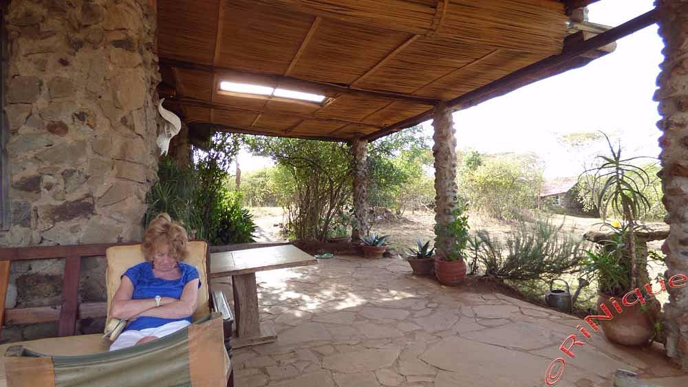 Guest reading on the cottage veranda